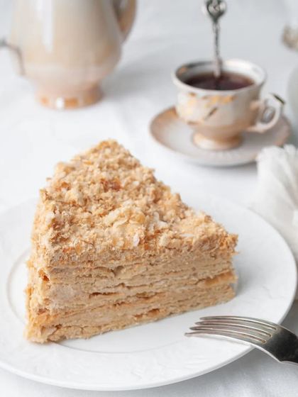 A perfect slice of cake paired with a warm cup of tea is one of life's simple pleasures. This layered pastry is perfect for an afternoon break or a quiet moment of self-care.