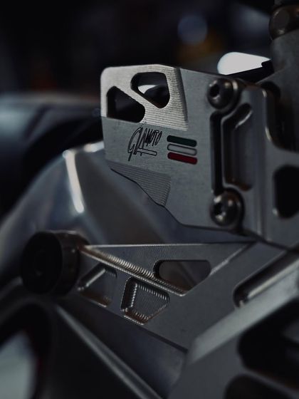 Another angle of the intricate rearsets on the Aprilia.