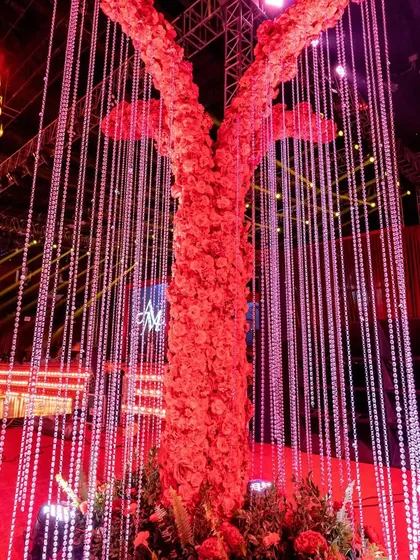 Another perspective of the magnificent floral tree, this time adorned with hanging crystal strands that caught the light and added another dimension of sparkle and luxury.