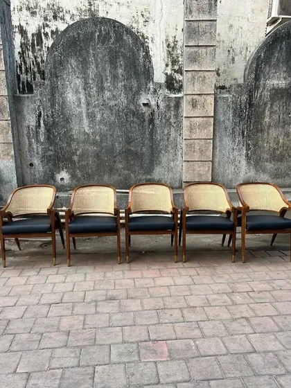 A front-on view of five of the dining armchairs.