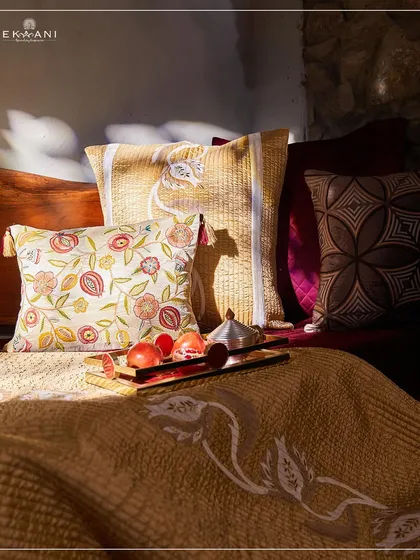 I believe your home should be a legacy. Here, the rich, pomegranate-inspired hues of my Anardana collection come to life, blending plush velvet textures with intricate embroidery to create a space that feels both grand and deeply personal.
