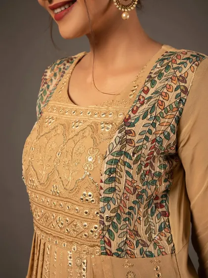 A close-up on the fabric and embroidery. This shot is essential for showing the quality and craftsmanship of the garment to potential buyers.