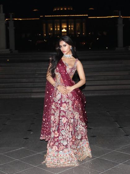 Another view of the stunning maroon lehenga, highlighting the incredible detail and craftsmanship.