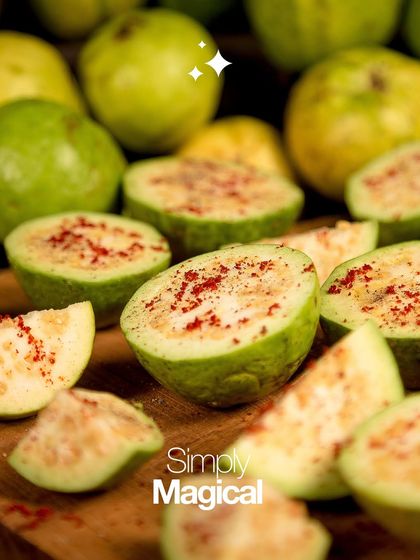 The magic of my snacks starts with fresh, high-quality ingredients. Here you can see the vibrant green guavas, halved and sprinkled with spice, ready to be transformed into a delicious treat.