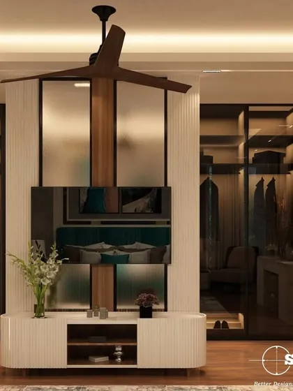 This innovative bedroom design features a rotating TV unit that also acts as a partition for the walk-in closet behind it. It's a perfect solution for maximizing space and functionality without compromising on style.