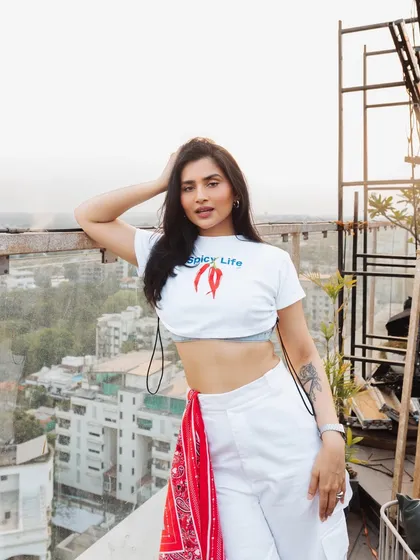 Posing on the rooftop before my sundowner set. The "Spicy Life" tee perfectly captures the energy I bring to my music.