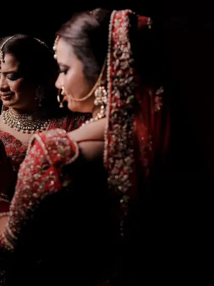 A reflective and emotional bridal portrait. Using a mirror, I captured the bride looking at her own reflection, creating a powerful image of self-love and contemplation before the ceremony begins. The dark, moody lighting adds to the intimacy of the moment.