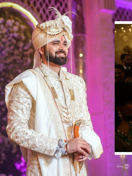 A portrait of the groom, looking on with a happy and content smile. His elegant white sherwani and the festive lighting make for a classic wedding shot.