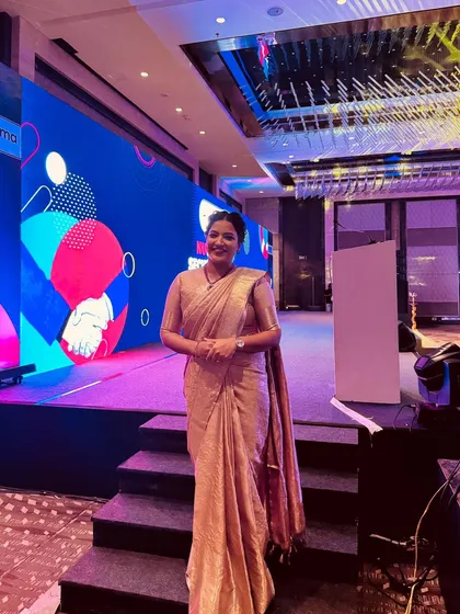 Another view of the stage for the Bharti AXA and Nuvama event. I am comfortable on large, modern stages with complex lighting and screen setups.