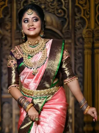 This series features a model in a pink and brown saree, wearing a heavy bridal set with green stone accents, showcasing a complete and regal look.