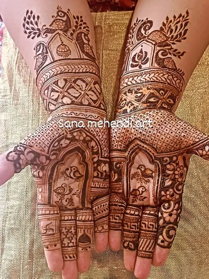 A Teej festival design with birds in a window and peacock motifs on the arms.