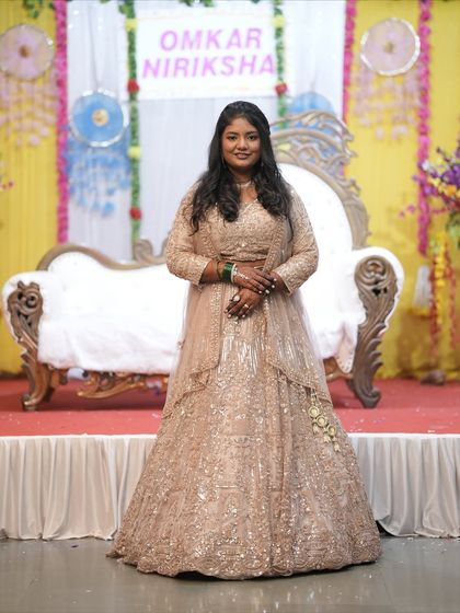 A beautiful bride-to-be at her engagement ceremony wearing my sequined beige lehenga. This outfit is a fantastic choice for making a grand entrance.