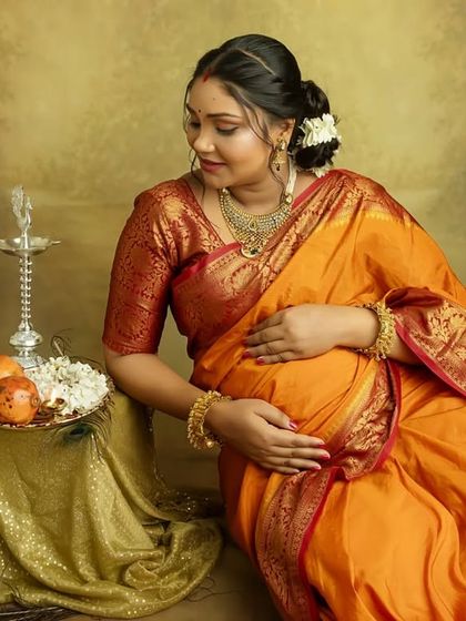 A beautiful seated portrait that highlights the intricate details of your saree and the serene expression on your face. A truly timeless memory.