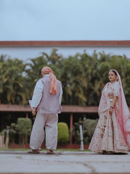 A shot of the couple's first look, with the groom in the background and the bride in the foreground.