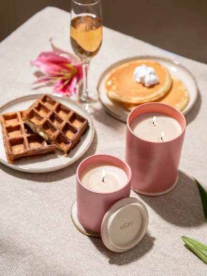 We styled these candles as part of a luxurious brunch-at-home scene. The waffles, pancakes, and champagne create an aspirational lifestyle moment, showing how the candles can elevate an everyday experience.