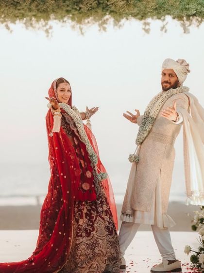 The happy couple striking a pose after their wedding. Their joy and energy are infectious. So much love for them.