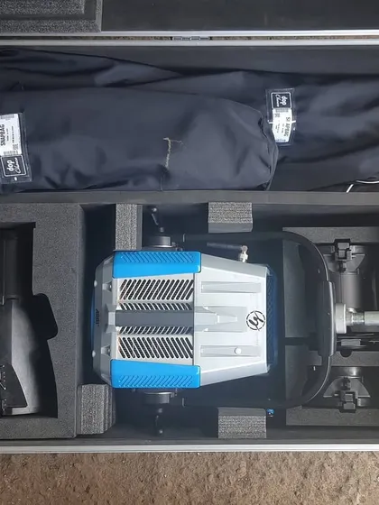 The complete Arri Orbiter kit in its flight case. This single-point source LED features a six-color engine and comes with a range of optics and softboxes, making it a highly adaptable lighting tool.