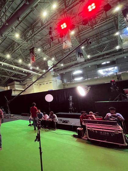 The production area for an e-sports event, showing the green screen and camera crane. Our venue accommodates the extensive technical and broadcast needs of modern e-sports.