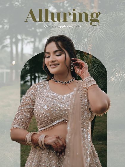 "Alluring." A beautiful portrait of the bride, Pallavi, adjusting her earring. The soft, natural background and her gentle expression create a captivating and graceful image.