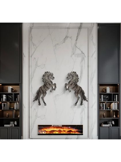 A pair of "Rising Horse" sculptures installed symmetrically over a fireplace, creating a powerful and balanced focal point in a luxury interior.