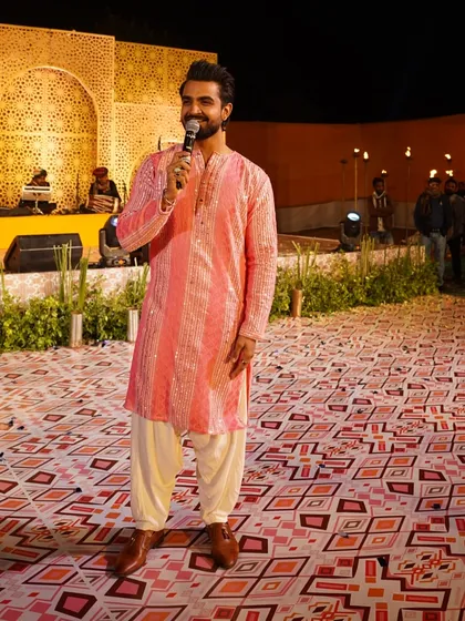 A confident pose, ready to engage with the audience.