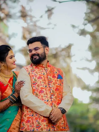 A close-up shot capturing the loving gaze between the couple during their traditional engagement photoshoot.