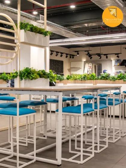 Where function meets finesse. I design commercial spaces that inspire collaboration and creativity. This common area uses vibrant seating, modern lines, and green touches for interior innovation.