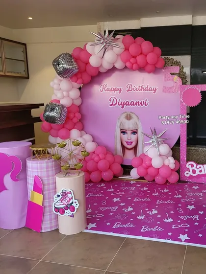 This angle shows the different props available for the Barbie theme, including themed pedestals and a miniature ferris wheel.