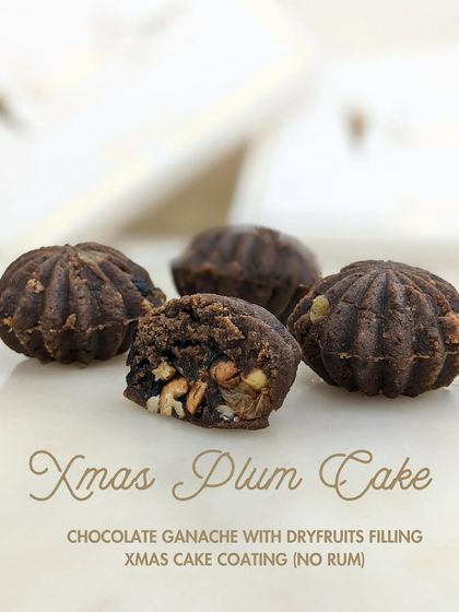 Our Xmas Plum Cake Mithai, which captures the flavor of a traditional Christmas cake with a chocolate ganache and dry fruit filling, but with no rum.