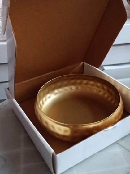 My hammered metal urli, shown packaged in a simple cardboard box. This is a great option for gifting or for shipping the item safely.