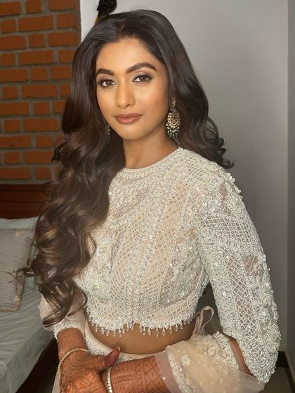 The complete look is modern and sophisticated. The makeup is glamorous but still lets her natural beauty shine through.