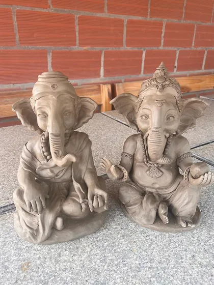 A pair of Ganesha idols I sculpted, each with a unique expression. They feel like old friends sitting together.