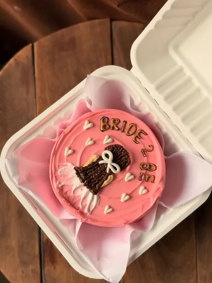 A close-up of my popular "Bride to Be" bento cake, showing the detailed piping work on the dress. It's a sweet and personal way to celebrate before the big day.