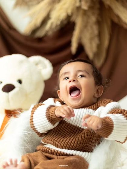 A big yawn from a happy baby. Our sitter sessions are relaxed, allowing us to capture all sorts of adorable expressions.