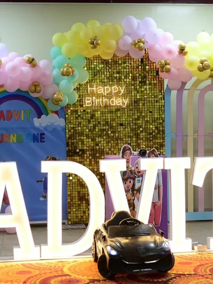 Another view of Advit's party setup, showing the marquee letters and the full stage design.