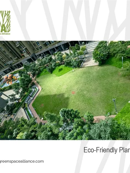 An example of our eco-friendly planning in a residential setting, showcasing a large, open green lawn that serves as a community gathering space. We prioritize maximizing green cover to improve air quality, reduce the heat island effect, and promote well-being.