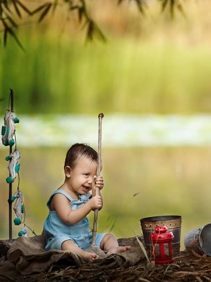 This little fisherman is hard at work! I love capturing these action shots during outdoor sessions. They show so much personality and tell a wonderful story about your child's imagination.