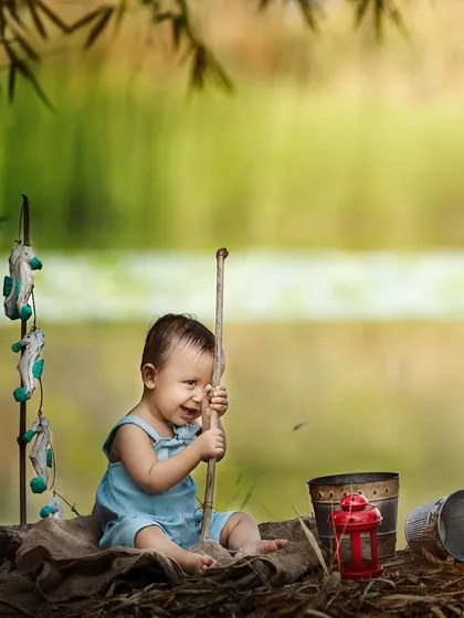 This little fisherman is hard at work! I love capturing these action shots during outdoor sessions. They show so much personality and tell a wonderful story about your child's imagination.