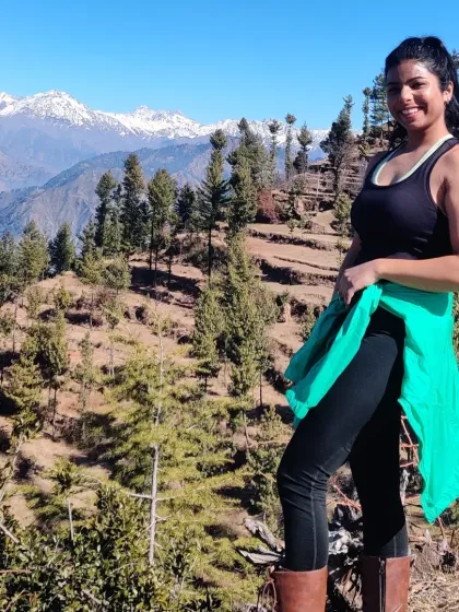 Posing during a mountain trek. My functional training prepares me for real-world adventures like this.