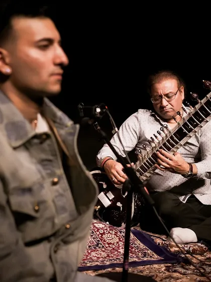 A moment during a 3am soundcheck, with my father in the background. He is always there, supporting me and ensuring my instrument is perfect. This legacy is a shared journey.