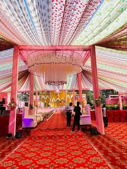 Another view of the colorful draped tent, showing the scale and grandeur of the overhead decoration.