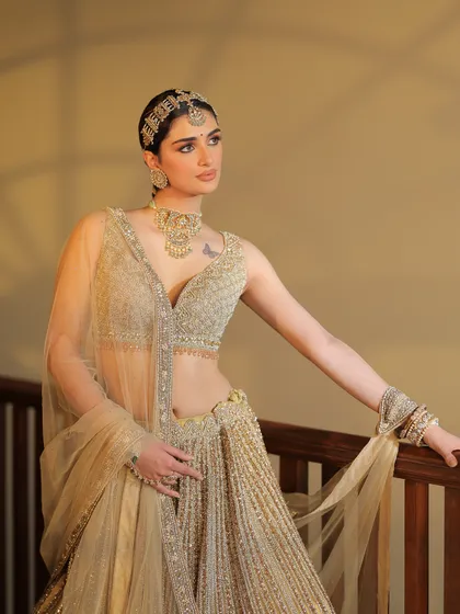 A classic pose on a staircase. I styled this golden lehenga with a sheer dupatta and a statement matha patti for a look of modern royalty.