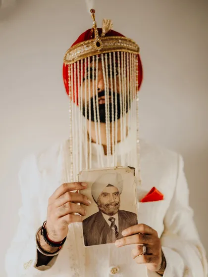This was one of the most moving moments I've ever witnessed. The groom, Rahat, holding a portrait of his grandfather, connecting generations through a single, powerful image. It’s a reminder that weddings are about family, history, and the love that carries on.