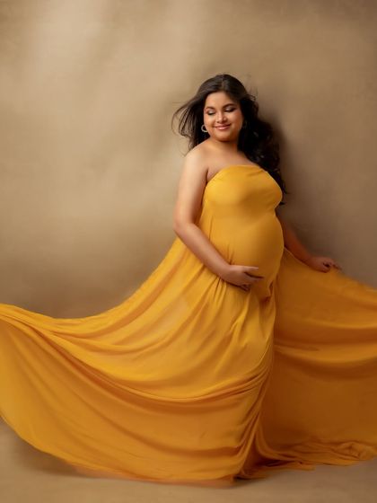 The way this yellow fabric flows feels like pure sunshine. A happy, vibrant portrait for a happy mama.