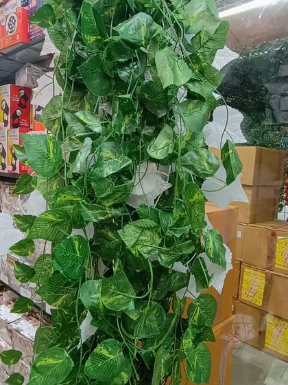 A lush artificial ivy vine. These are incredibly versatile for decoration, whether you're wrapping them around pillars, hanging them from the ceiling, or adding them to a backdrop.