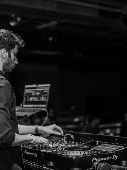 Another angle of me working the decks at Sunburn, showing the Pioneer DJ setup.