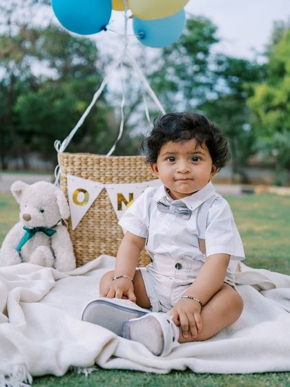 A classic portrait for a first birthday. This little one is looking so dapper, sitting patiently before the cake smash begins. These are the sweet, calm moments before the fun chaos.