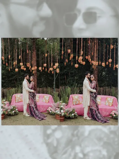 A diptych of the couple posing under a beautiful floral installation at their Haldi ceremony. The pink sofas and hanging hearts create a romantic and festive backdrop.