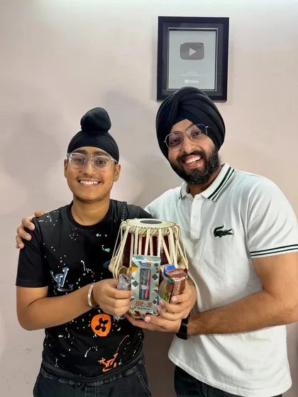 Another one of my bright students receiving a gift during our academy meetup. He even brought me a handmade miniature tabla, which was such a sweet gesture.