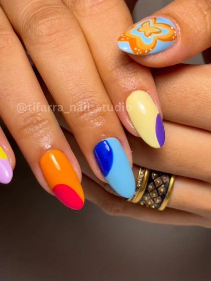 Another angle of the creative and colorful mismatched nail art set.